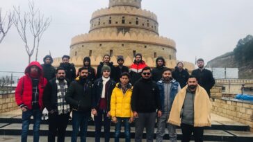 Group photo at bridge