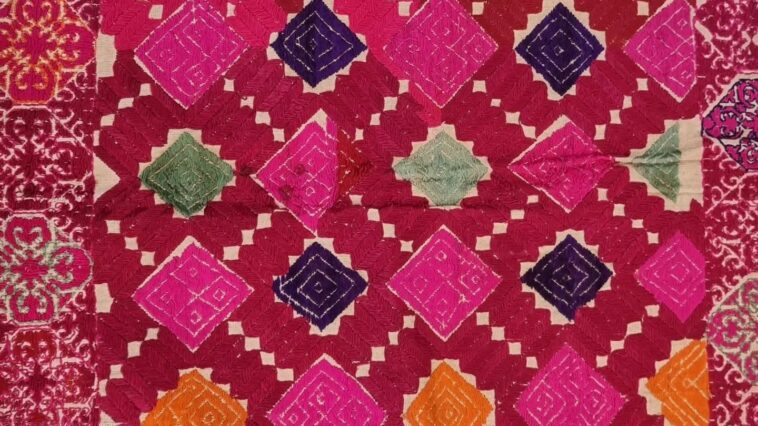 Rich geometric stitching in silk on the Swat Valley wedding cushion